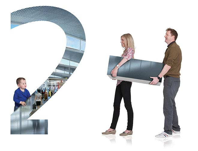a man and woman holding a large number