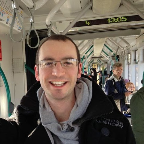 a man taking a selfie in a train
