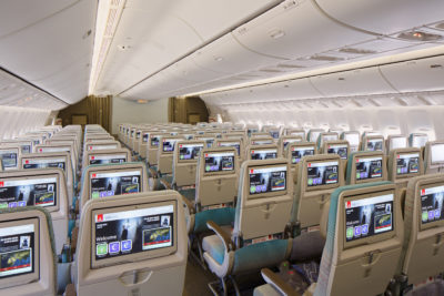 an airplane with many seats and monitors
