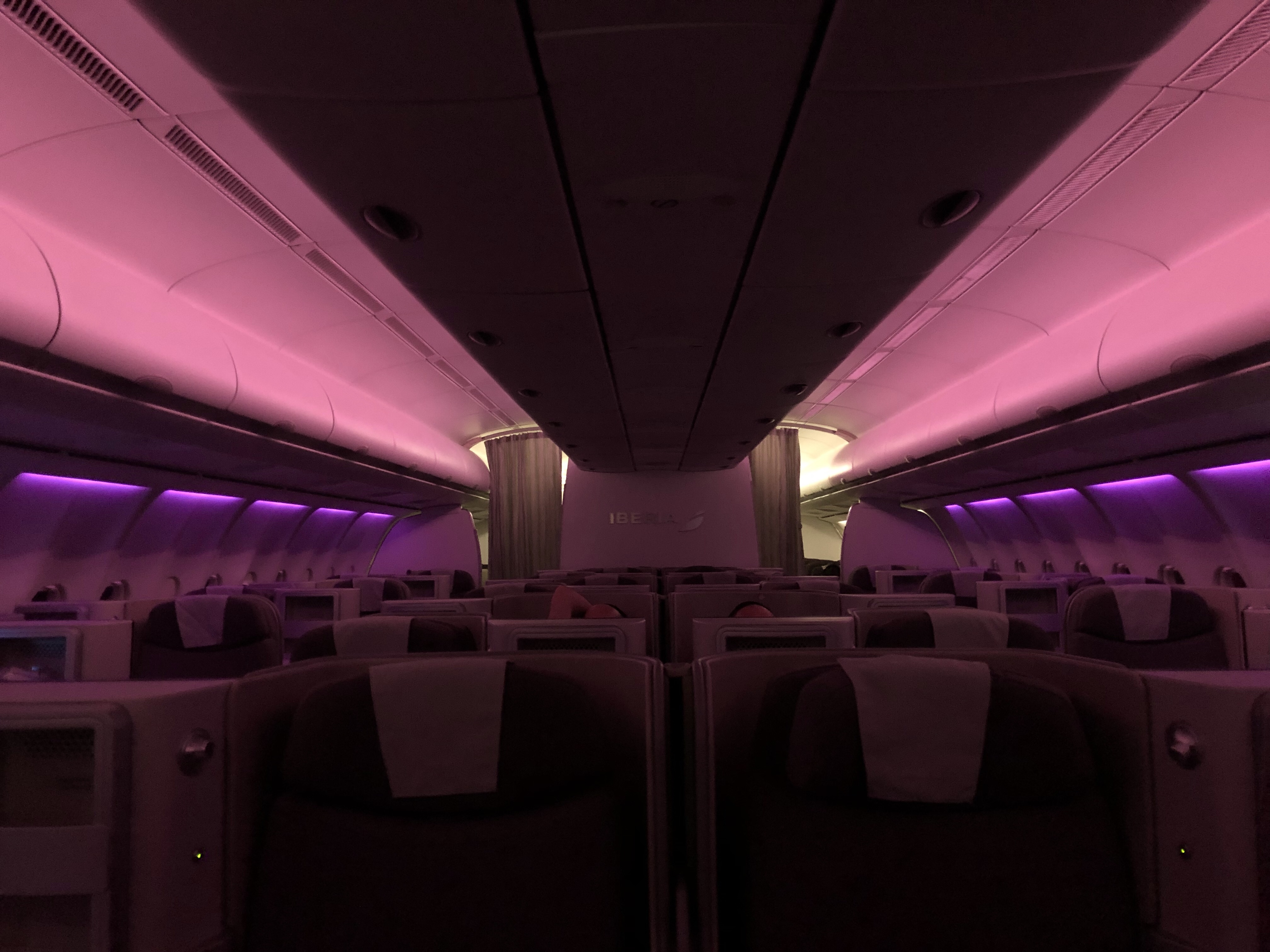 inside an airplane with purple lights