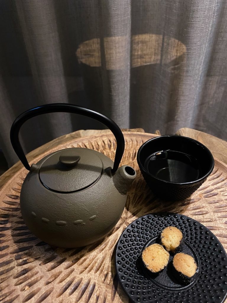 a teapot and a cup of tea on a table